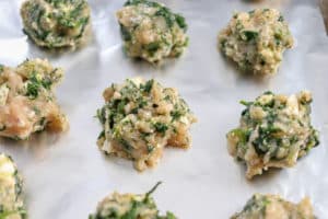 Greek Meatballs with Feta and Spinach on baking sheet