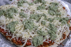 Homemade Pizza with Tomato and Pesto Ricotta Sauce